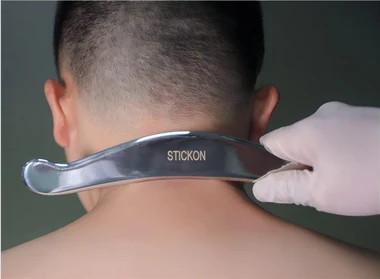 A STICKON scraper worked across the back of a neck